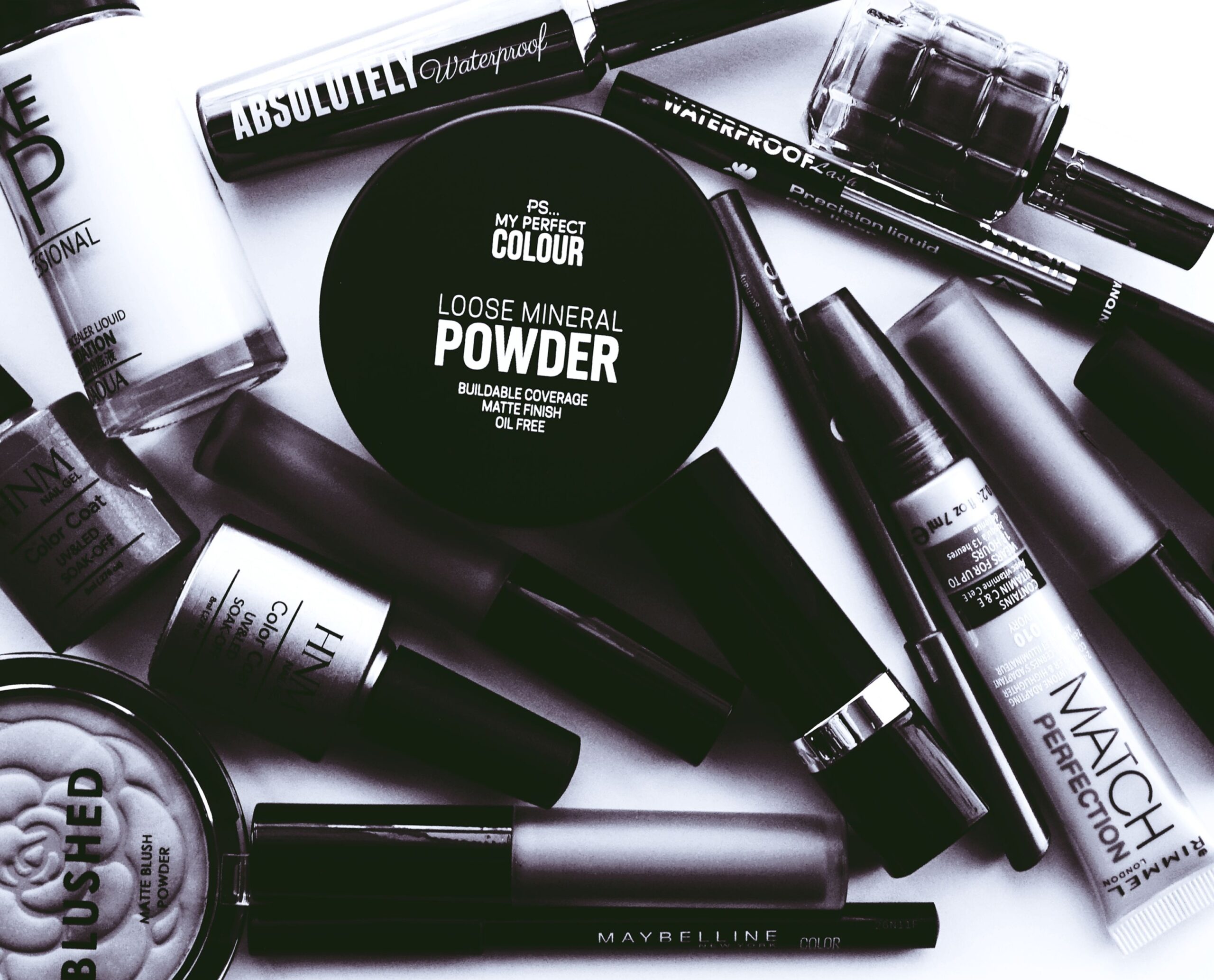 Illuminate Your Gaze with SoulTree’s Ratnavalli Jewel Kohl: A New Era of Ayurvedic Beauty Elegant monochrome flatlay showcasing a collection of beauty products and cosmetics.